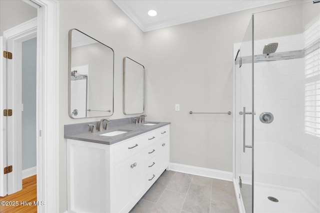 bathroom with tile patterned flooring, walk in shower, ornamental molding, and vanity