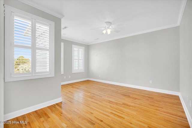 empty room featuring ceiling fan, light hardwood / wood-style flooring, and ornamental molding