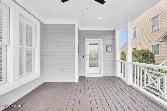 wooden terrace featuring ceiling fan