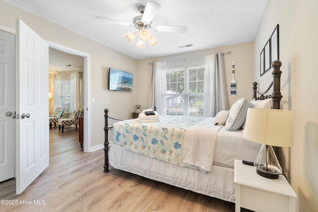 bedroom with hardwood / wood-style flooring and ceiling fan