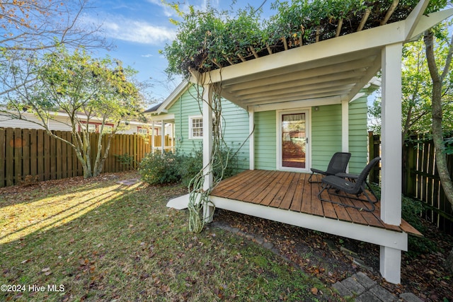 wooden deck with a lawn