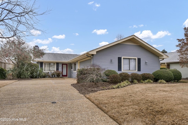 ranch-style house with a front yard