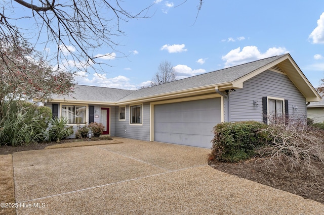 ranch-style house featuring a garage