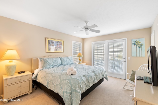 carpeted bedroom with access to exterior and ceiling fan