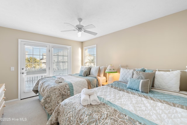 bedroom featuring light carpet, multiple windows, ceiling fan, and access to outside