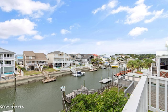 property view of water with a dock