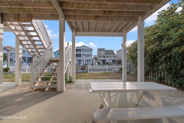 17 Leland St, Ocean Isle Beach, NC 28469 - view of patio / terrace with stairway and fence