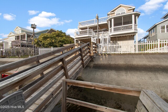 17 Leland St, Ocean Isle Beach, NC 28469 - exterior space featuring fence and a deck