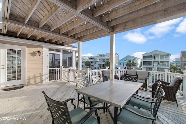 17 Leland St, Ocean Isle Beach, NC 28469 - wooden terrace featuring outdoor dining area and a residential view