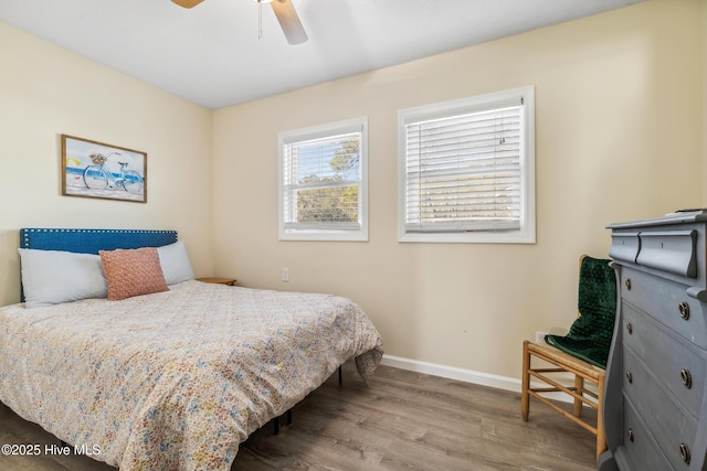 bedroom featuring hardwood / wood-style floors and ceiling fan