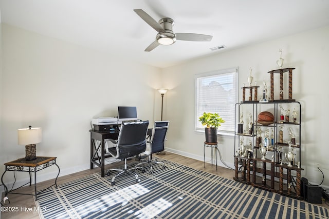 office space featuring ceiling fan and hardwood / wood-style floors