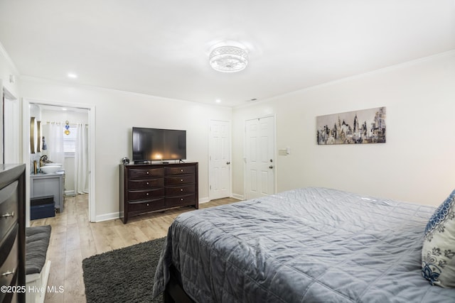 bedroom featuring light hardwood / wood-style flooring and ornamental molding