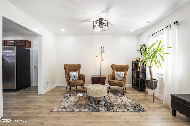 sitting room featuring light wood-type flooring