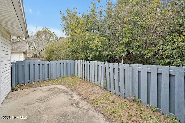 view of yard featuring a patio area and a fenced backyard