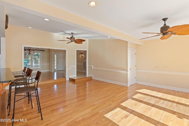 interior space with ceiling fan and light wood-type flooring