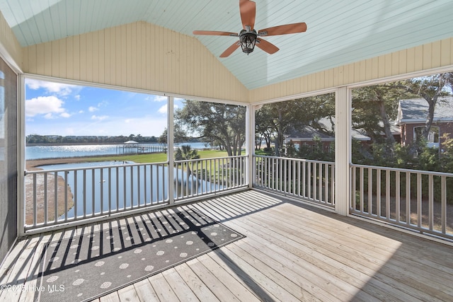 unfurnished sunroom featuring a water view, ceiling fan, and lofted ceiling