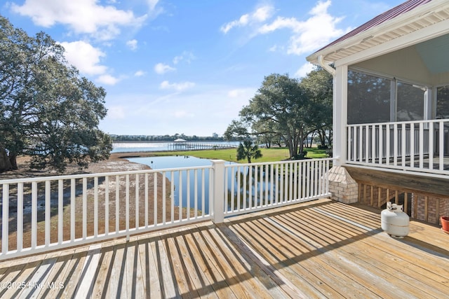 wooden deck with a water view