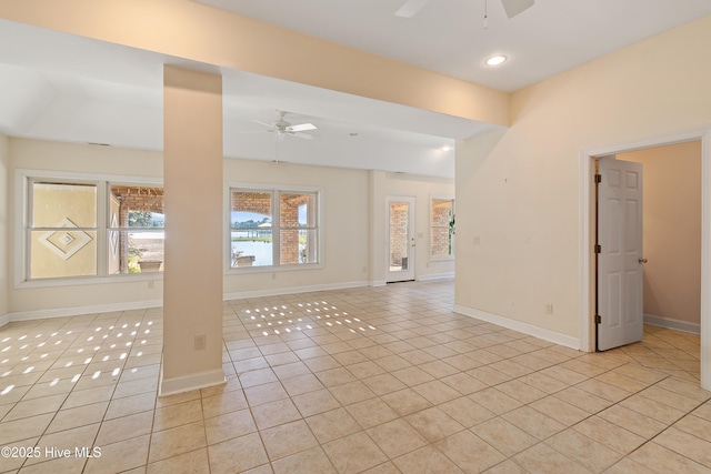 tiled empty room with ceiling fan