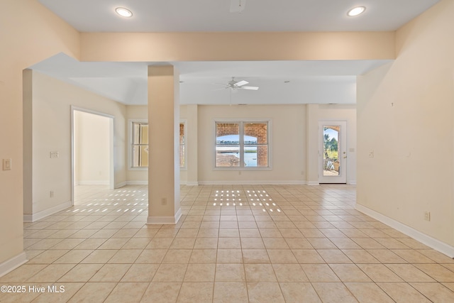 tiled empty room with ceiling fan