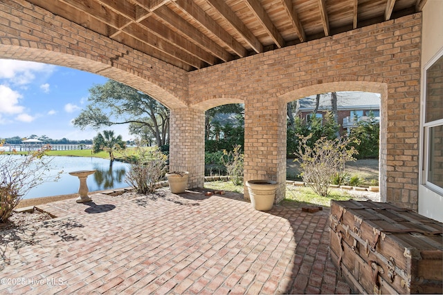 view of patio / terrace with a water view