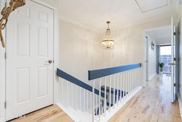 hallway featuring crown molding and hardwood / wood-style flooring