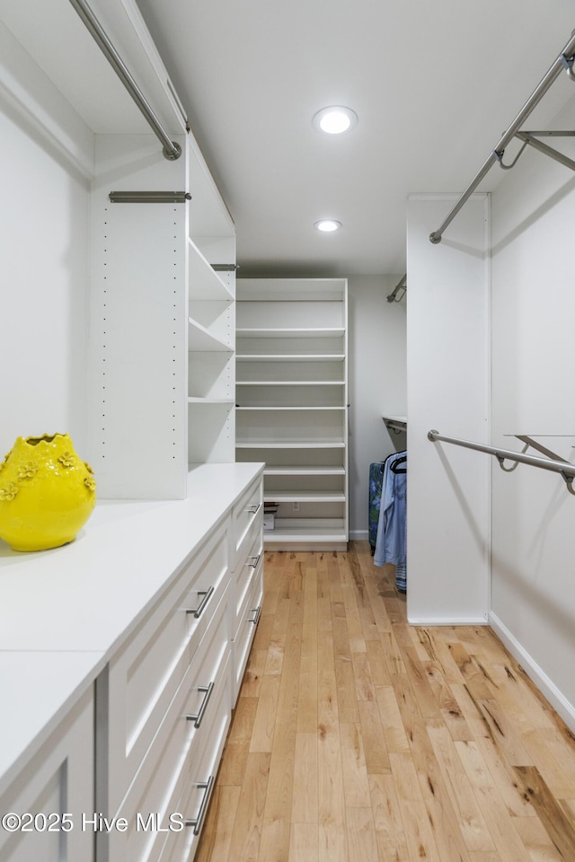 walk in closet featuring light wood-type flooring