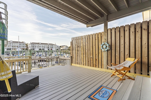 wooden deck with a water view