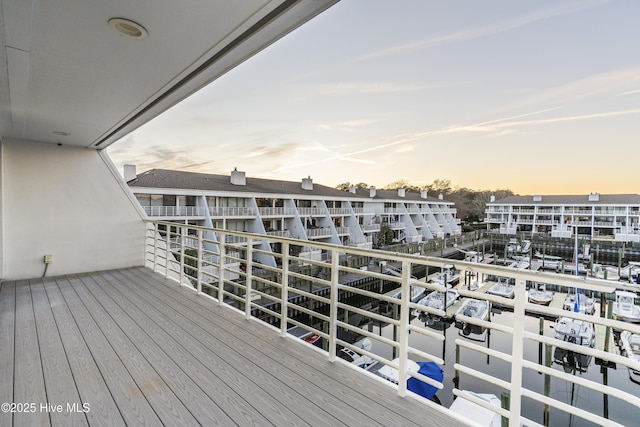 view of balcony at dusk