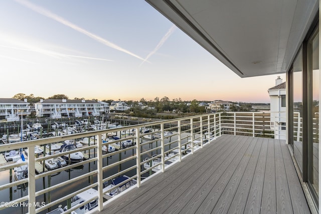 view of balcony at dusk