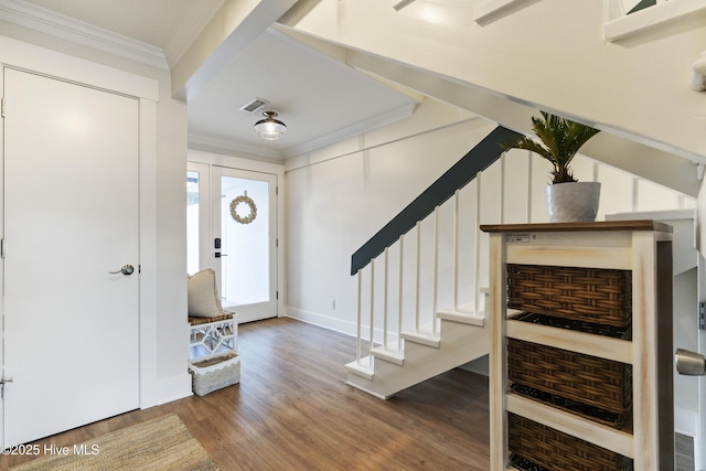 foyer entrance featuring wood-type flooring and ornamental molding