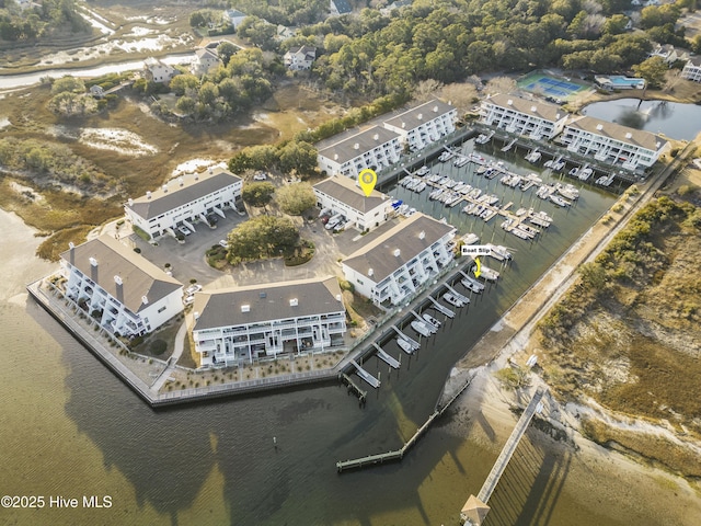 birds eye view of property with a water view