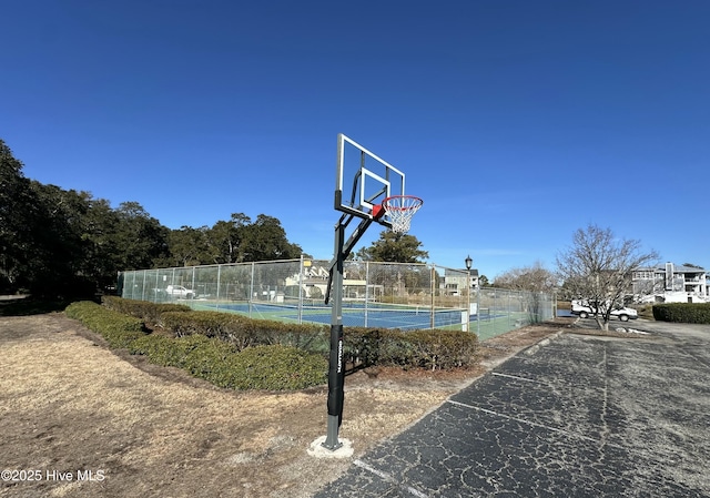 view of sport court featuring tennis court