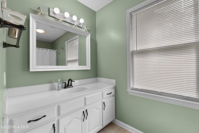 bathroom with tile patterned flooring and vanity