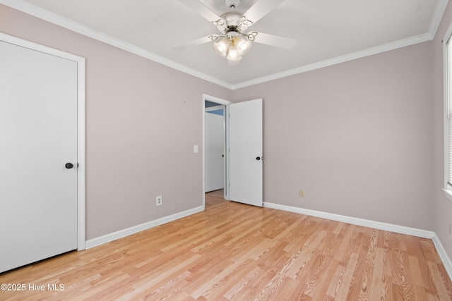 unfurnished bedroom featuring ceiling fan, light hardwood / wood-style flooring, and crown molding