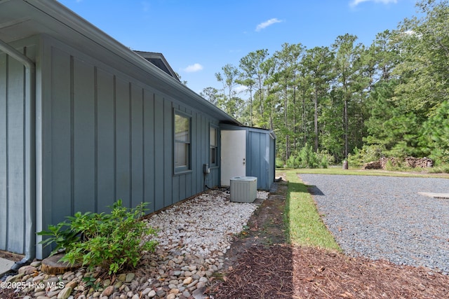 view of side of property featuring central AC