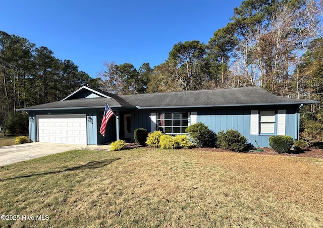 single story home with a garage and a front lawn