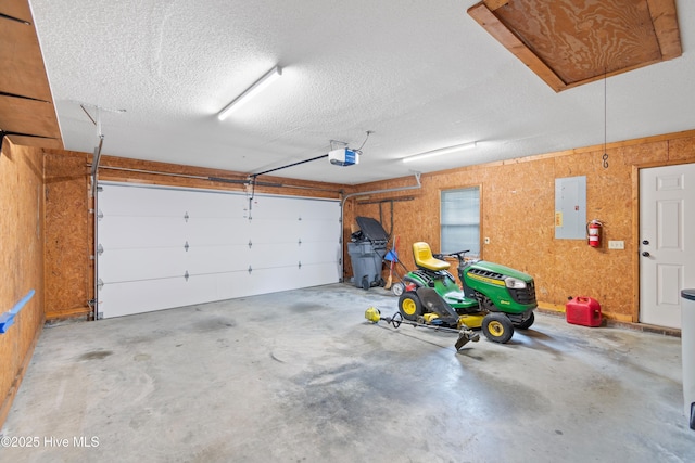 garage featuring electric panel and a garage door opener