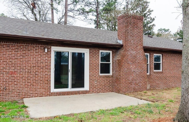 rear view of property featuring a patio