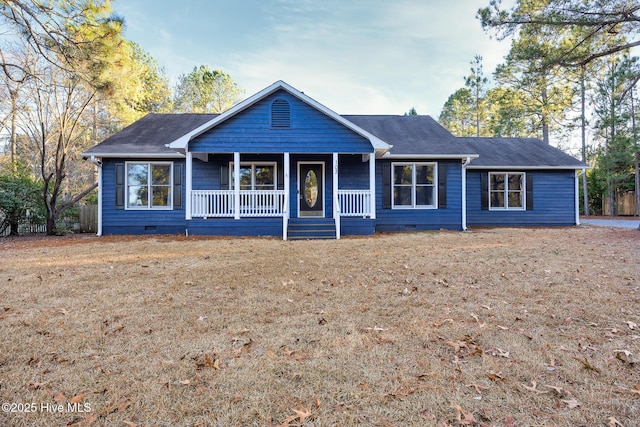 ranch-style home featuring a porch and a front yard