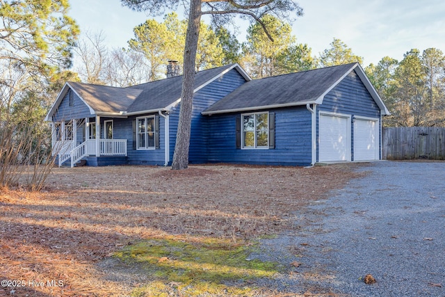 view of front of home with a garage and covered porch