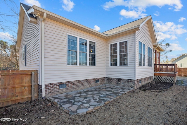 exterior space with a patio area and a deck