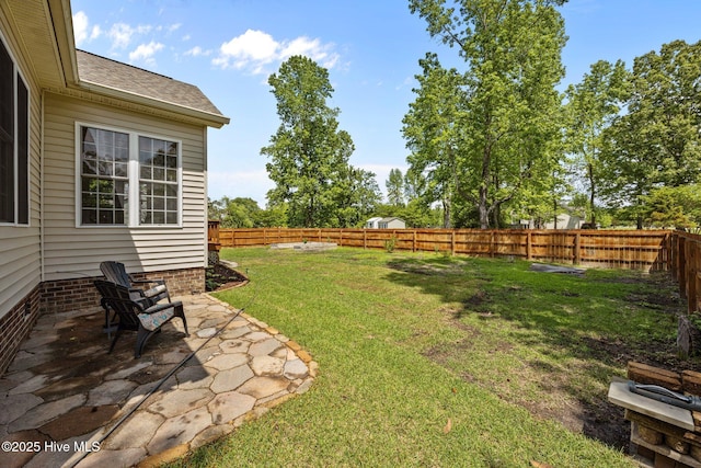 view of yard with a patio and a fenced backyard