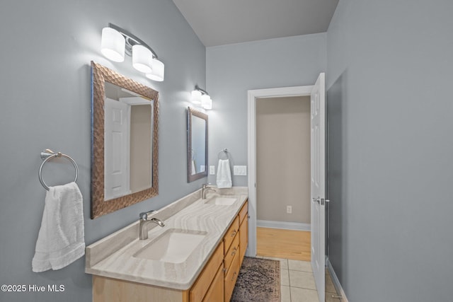 bathroom with vanity and tile patterned flooring