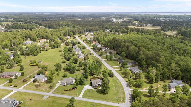 birds eye view of property with a residential view and a forest view