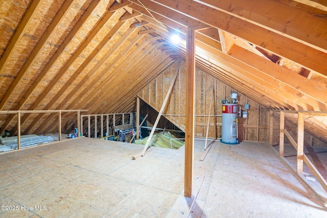 unfinished attic featuring water heater