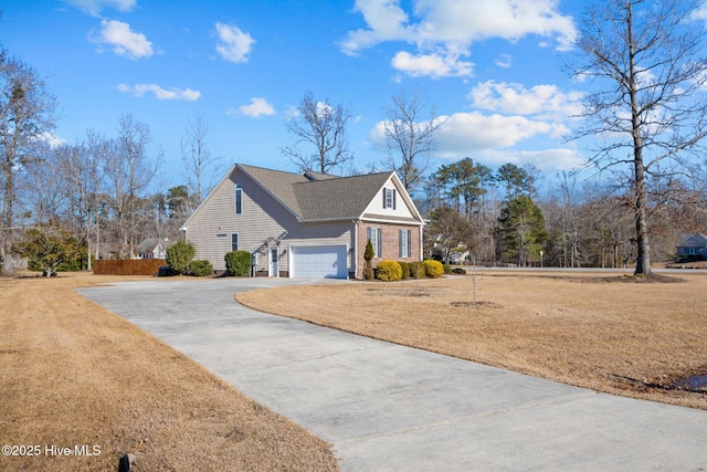 view of side of home with a garage and a lawn