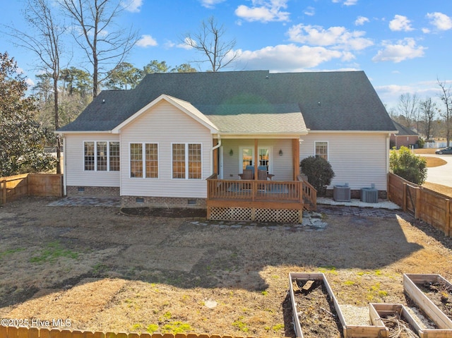 rear view of house with cooling unit and a wooden deck