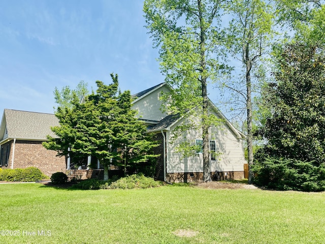 view of home's exterior featuring a lawn