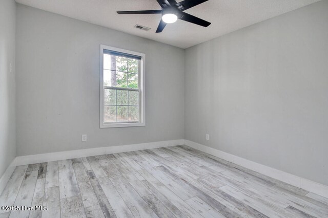 unfurnished room with ceiling fan and light hardwood / wood-style floors