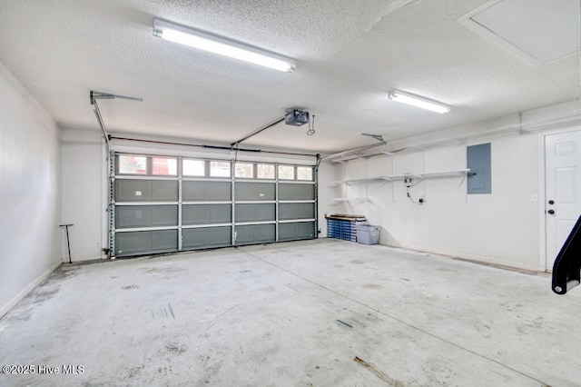 garage featuring a garage door opener and electric panel